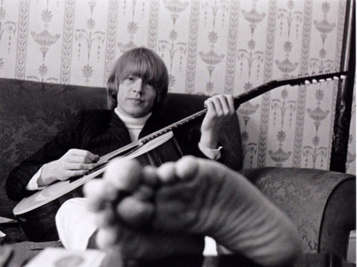 bj playing guitar in bed 1
